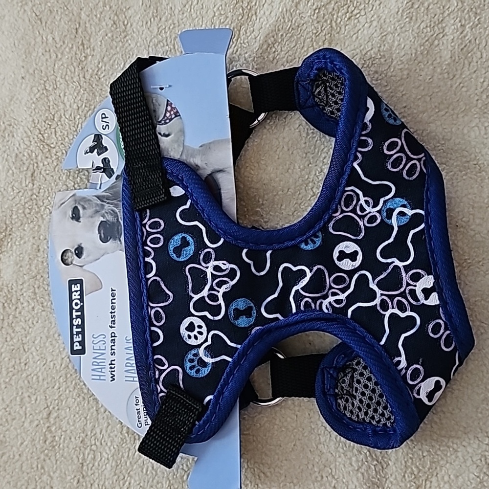 Harness with snap fasteners